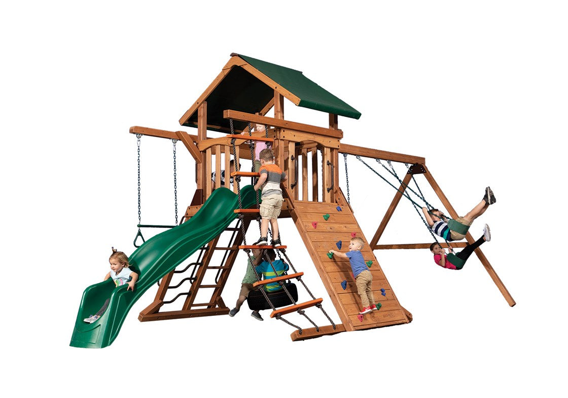 Adventure Summit 1 wooden playset: swings, slide, climbing wall, kids playing
