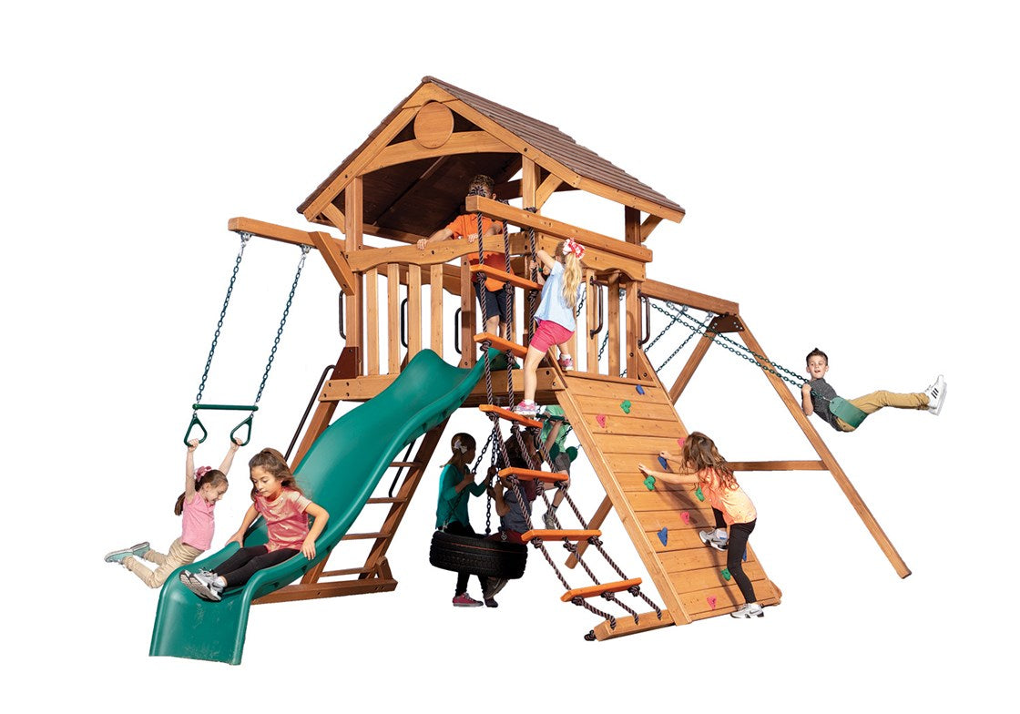 Adventure Summit XL 1 wooden playset: swings, slide, rock wall, & rope ladder; kids playing.