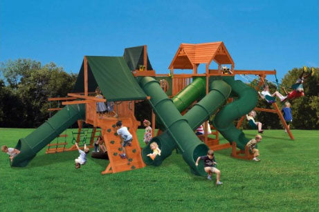 Extreme Deluxe Tunnel-O-Fun (39A) playset:  Large wooden structure with multiple slides, climbing wall, swings, and shaded area. Perfect for backyard fun!