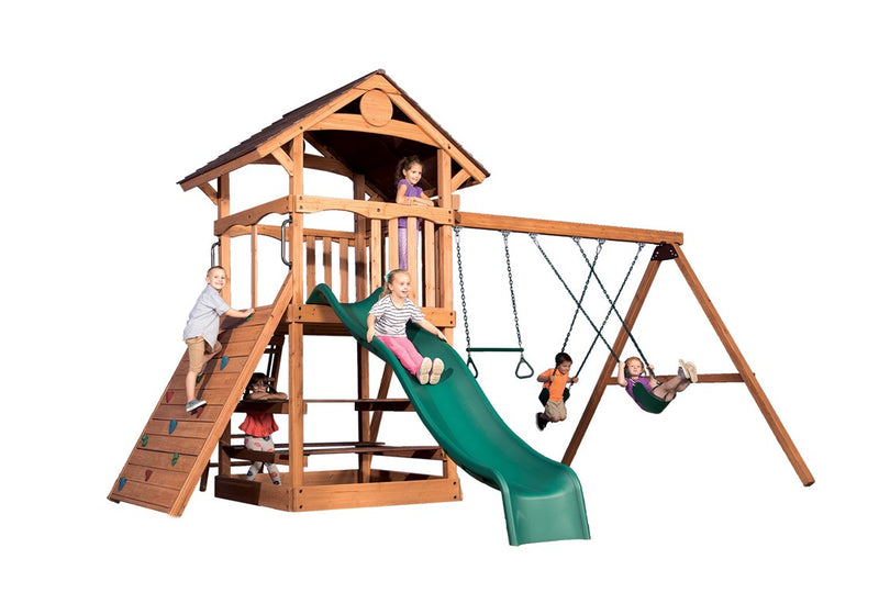 Adventure Outlook XL 1 wooden playset:  green slide, swings, climbing wall, kids playing.
